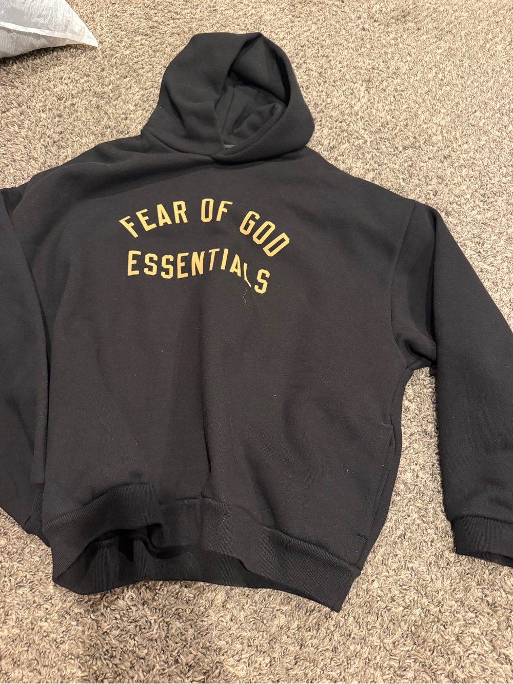 Fear of God Essentials Black Hoodie with Gold Arch Logo